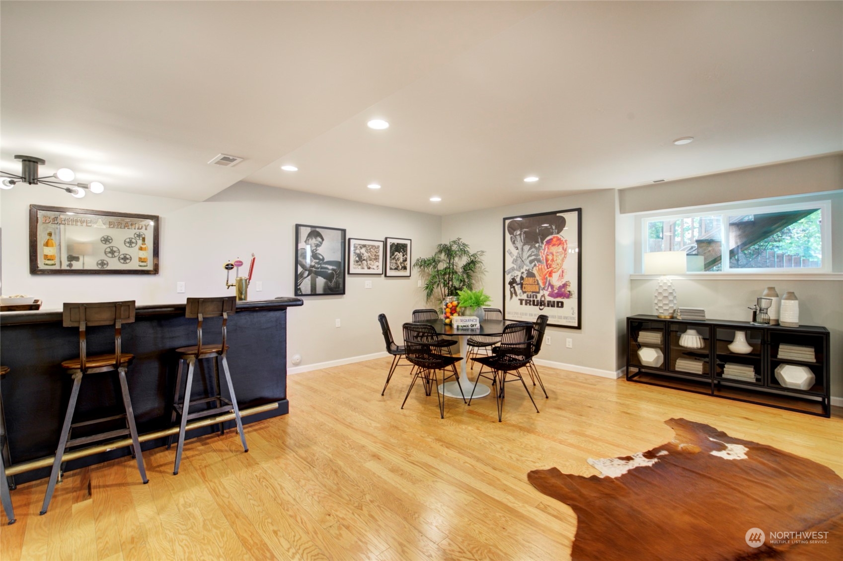 3649 22nd Avenue Southwest Seattle, WA 98106 - Photo 32 of 40 a living room with furniture a dining table and chairs