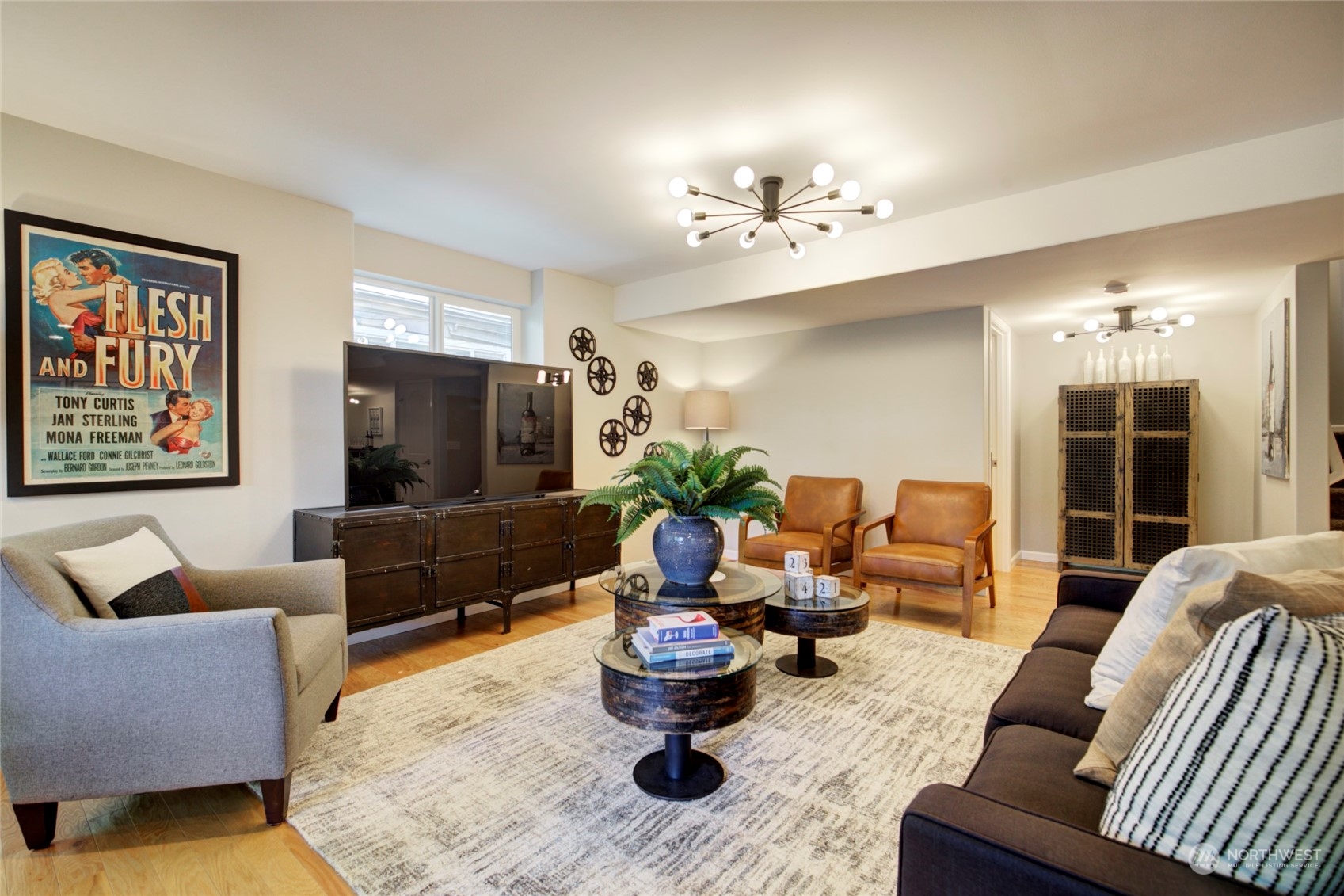 3649 22nd Avenue Southwest Seattle, WA 98106 - Photo 33 of 40 a living room with furniture and a chandelier