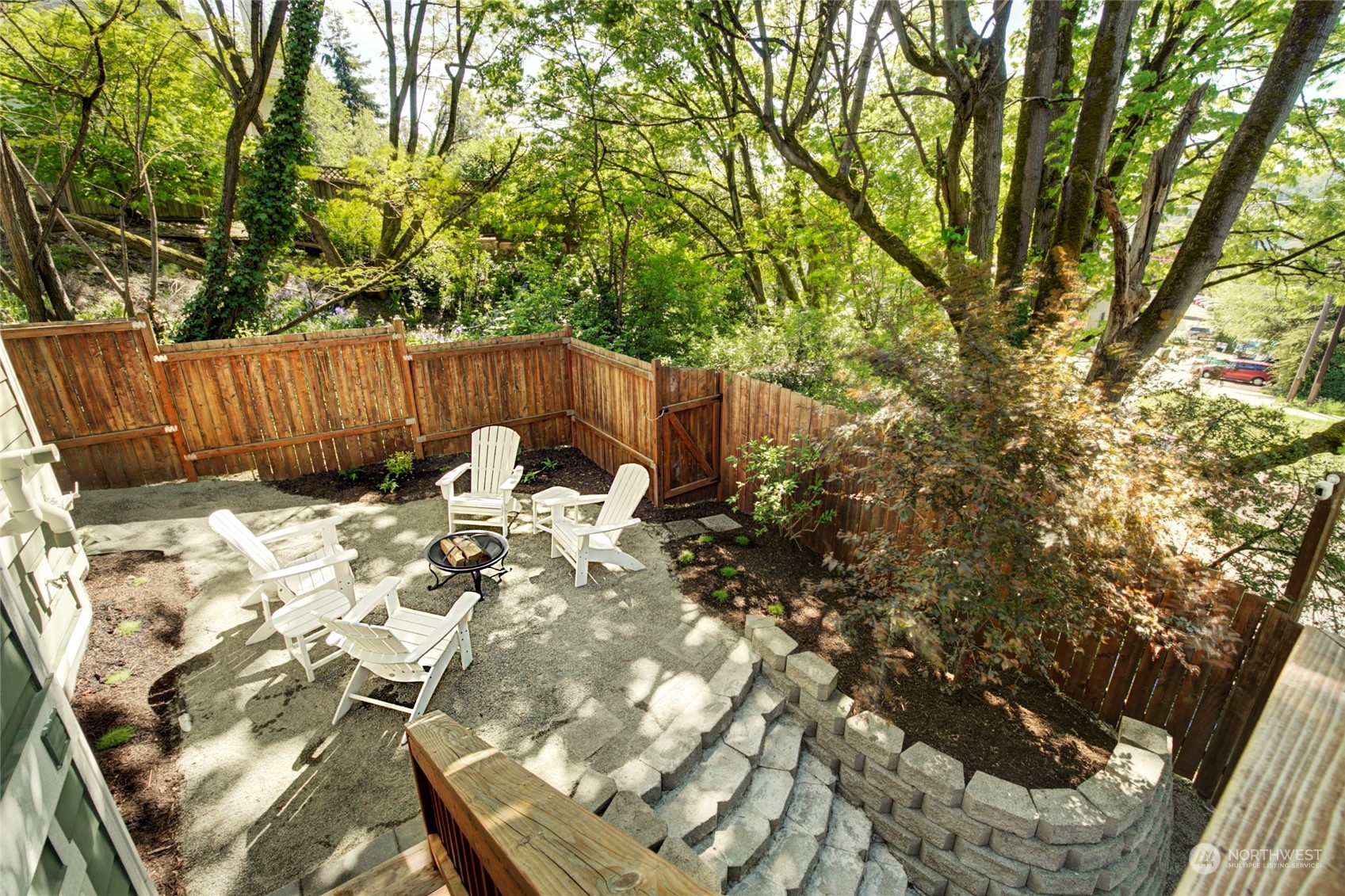 3649 22nd Avenue Southwest Seattle, WA 98106 - Photo 37 of 40 a view of backyard with table and chairs and potted plants