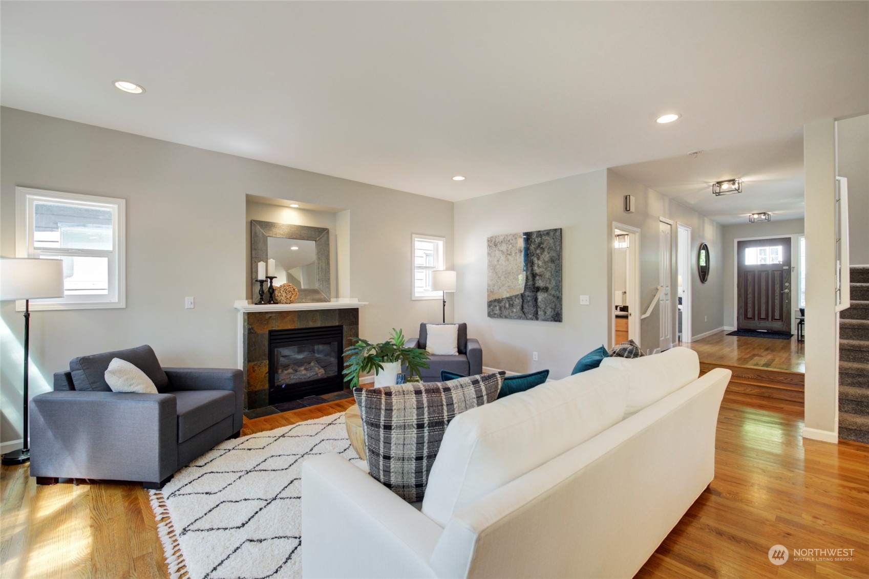 3649 22nd Avenue Southwest Seattle, WA 98106 - Photo 4 of 40 a living room with furniture and a fireplace