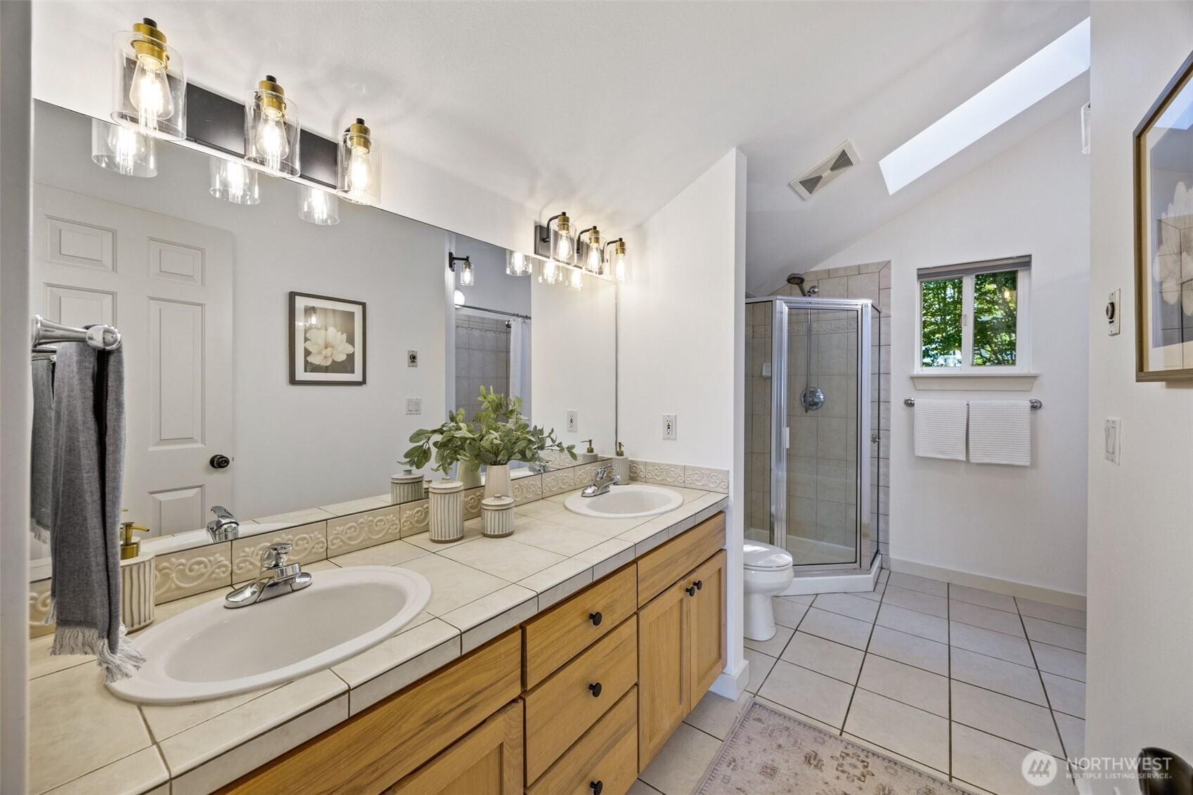 2613 East Howell Street Seattle, WA 98122 - Photo 12 of 31 a spacious bathroom with a granite countertop sink mirror and shower