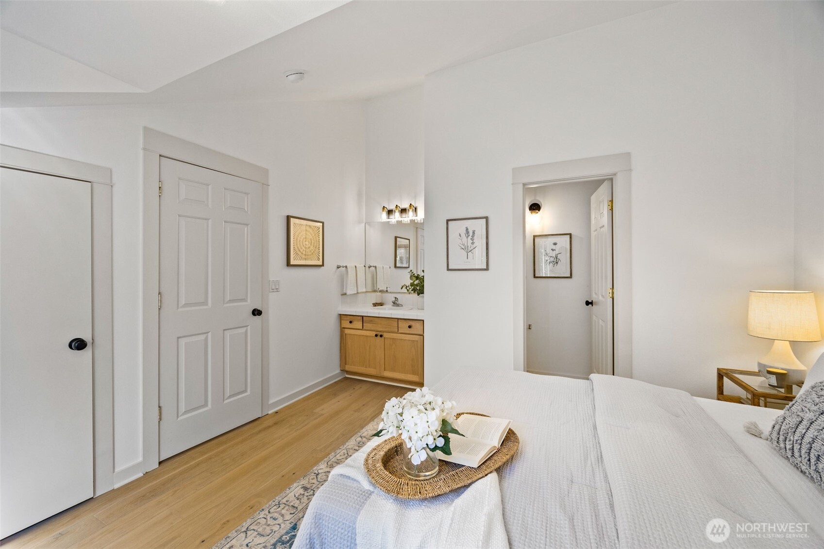 2613 East Howell Street Seattle, WA 98122 - Photo 16 of 31 a bedroom with a bed and a table in it