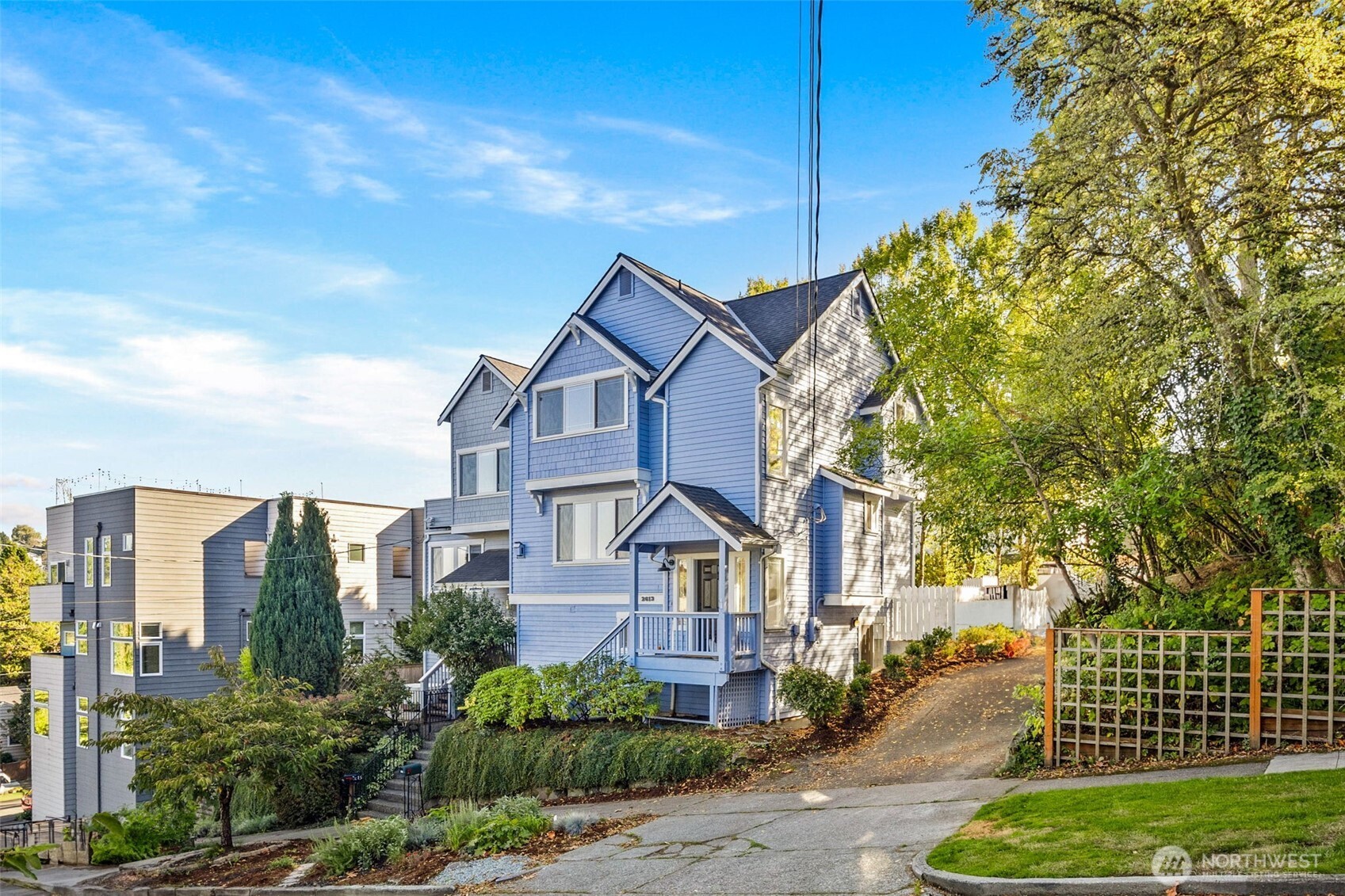 2613 East Howell Street Seattle, WA 98122 - Photo 2 of 31 a front view of a house with a yard