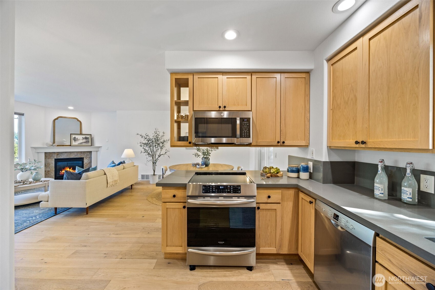 2613 East Howell Street Seattle, WA 98122 - Photo 8 of 31 a kitchen with a stove a sink and a microwave