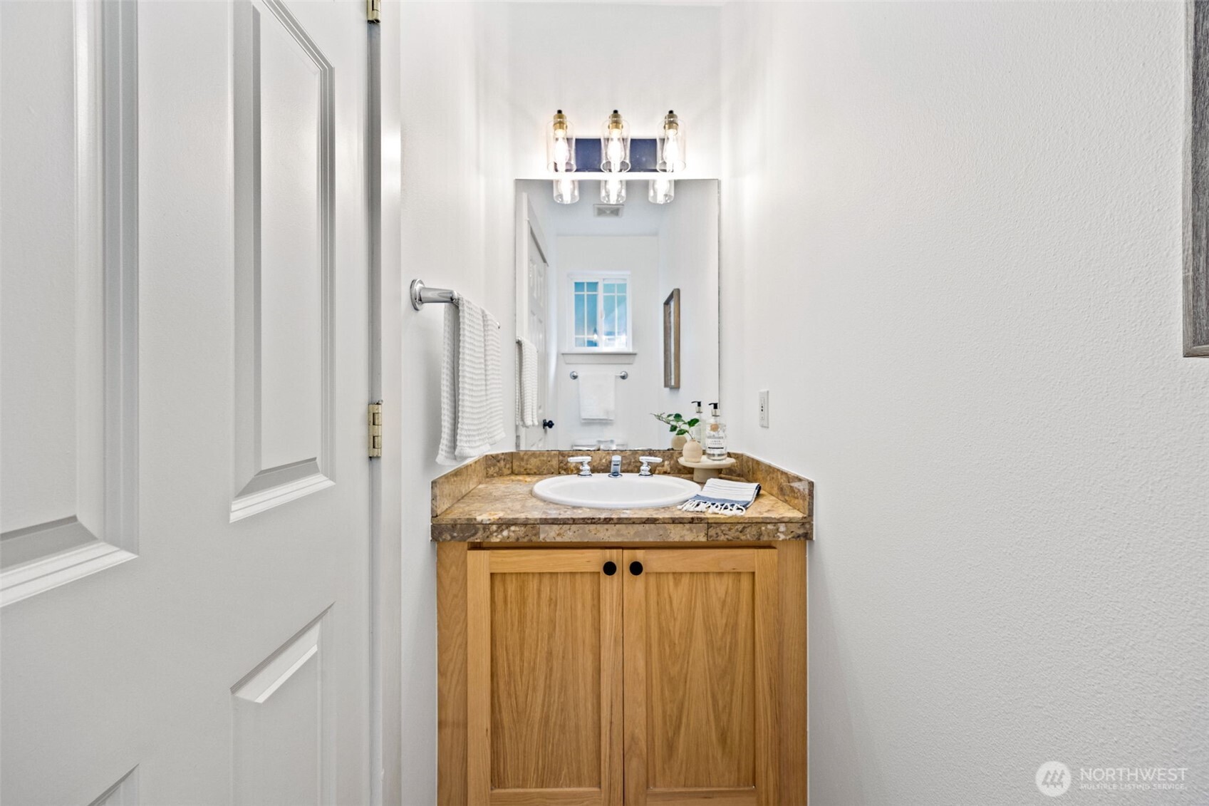 2613 East Howell Street Seattle, WA 98122 - Photo 9 of 31 a bathroom with a granite countertop sink and a mirror