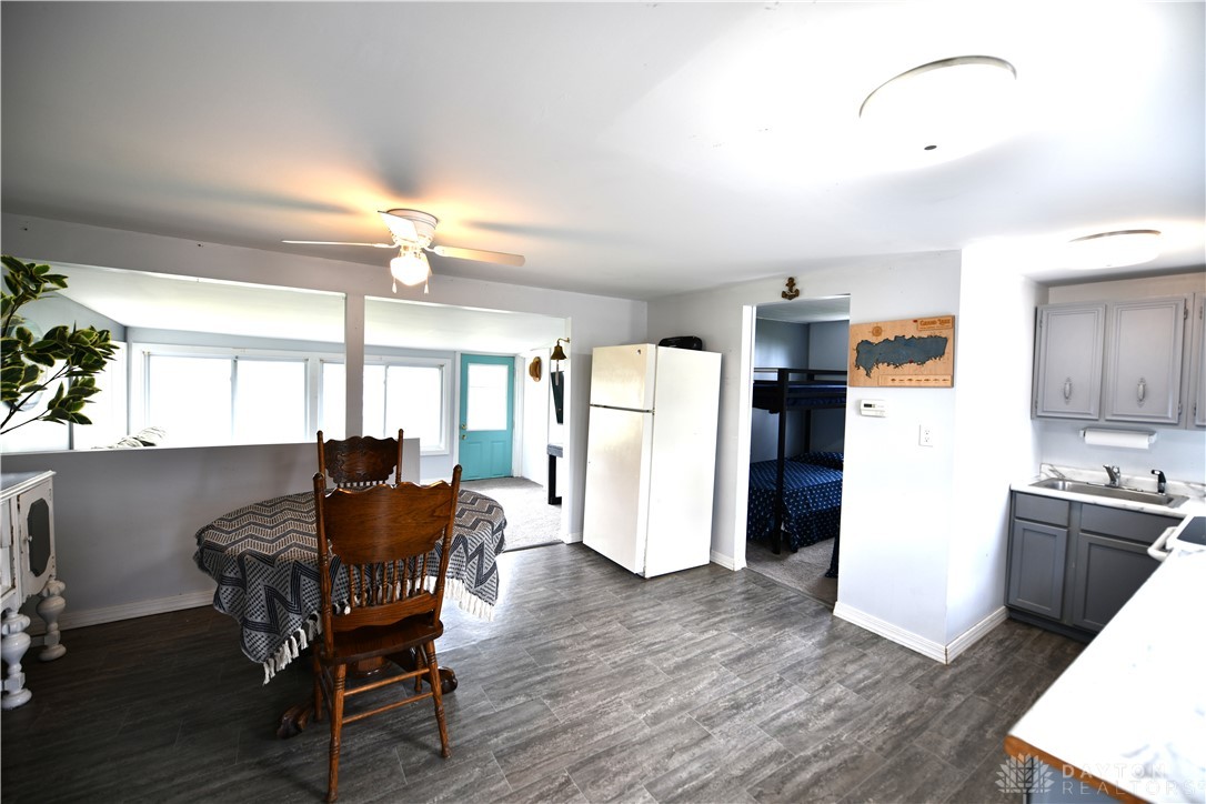 5445 Behm Road, Unit 15 Celina, OH 45822 - Photo 49 of 49 This inviting space combines dining and kitchen areas, offering comfort and practicality for daily living.