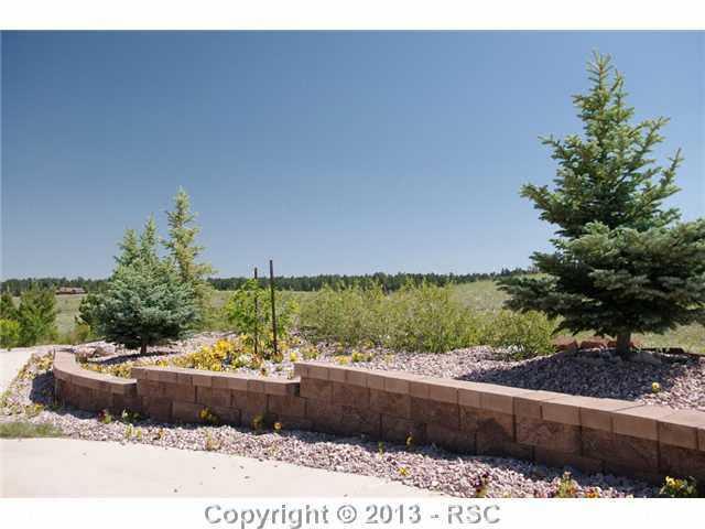 15028 Herring Road Colorado Springs, CO 80908 - Photo 17 of 17 Tiered landscaping in the front