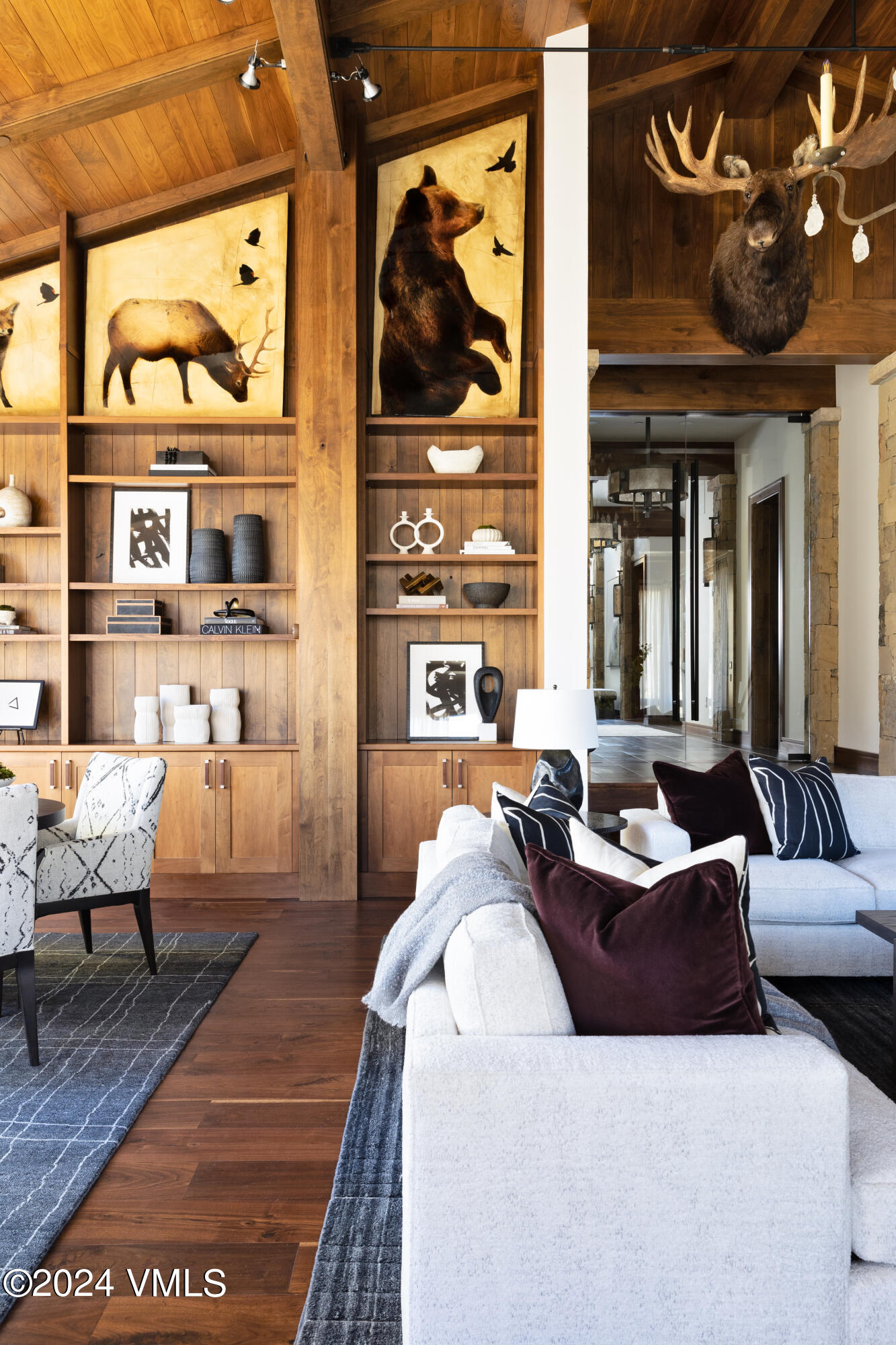 107 Rockledge Road Vail, CO 81657 - Photo 12 of 65 a living room with furniture a rug and wall painting