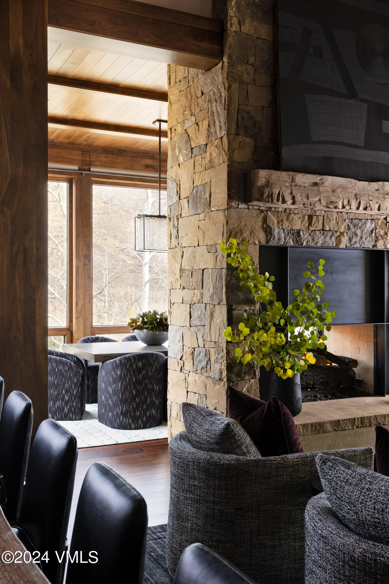 107 Rockledge Road Vail, CO 81657 - Photo 15 of 65 a living room with furniture flowerpot and a fireplace