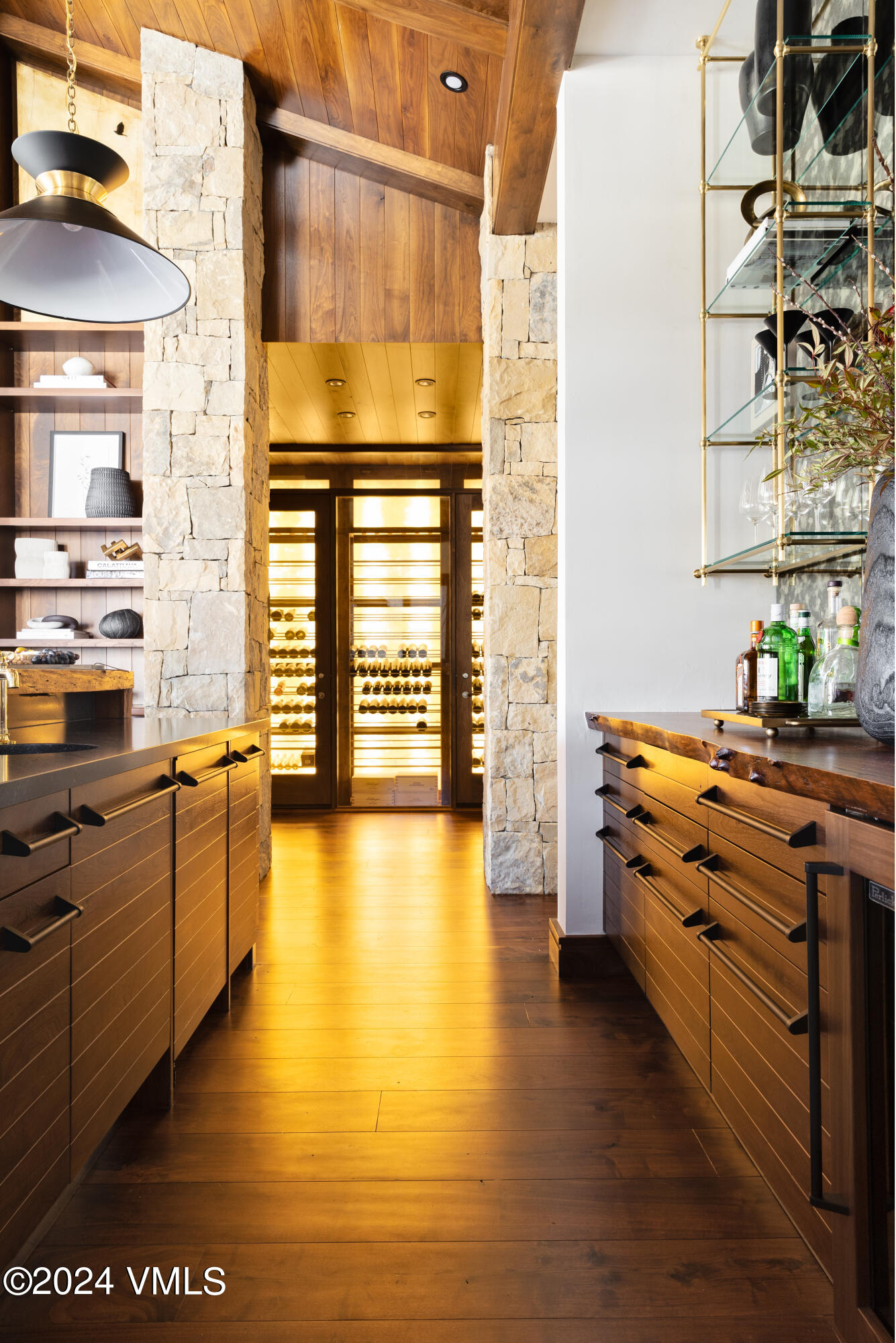 107 Rockledge Road Vail, CO 81657 - Photo 20 of 65 a kitchen with stainless steel appliances wooden floor and a large window