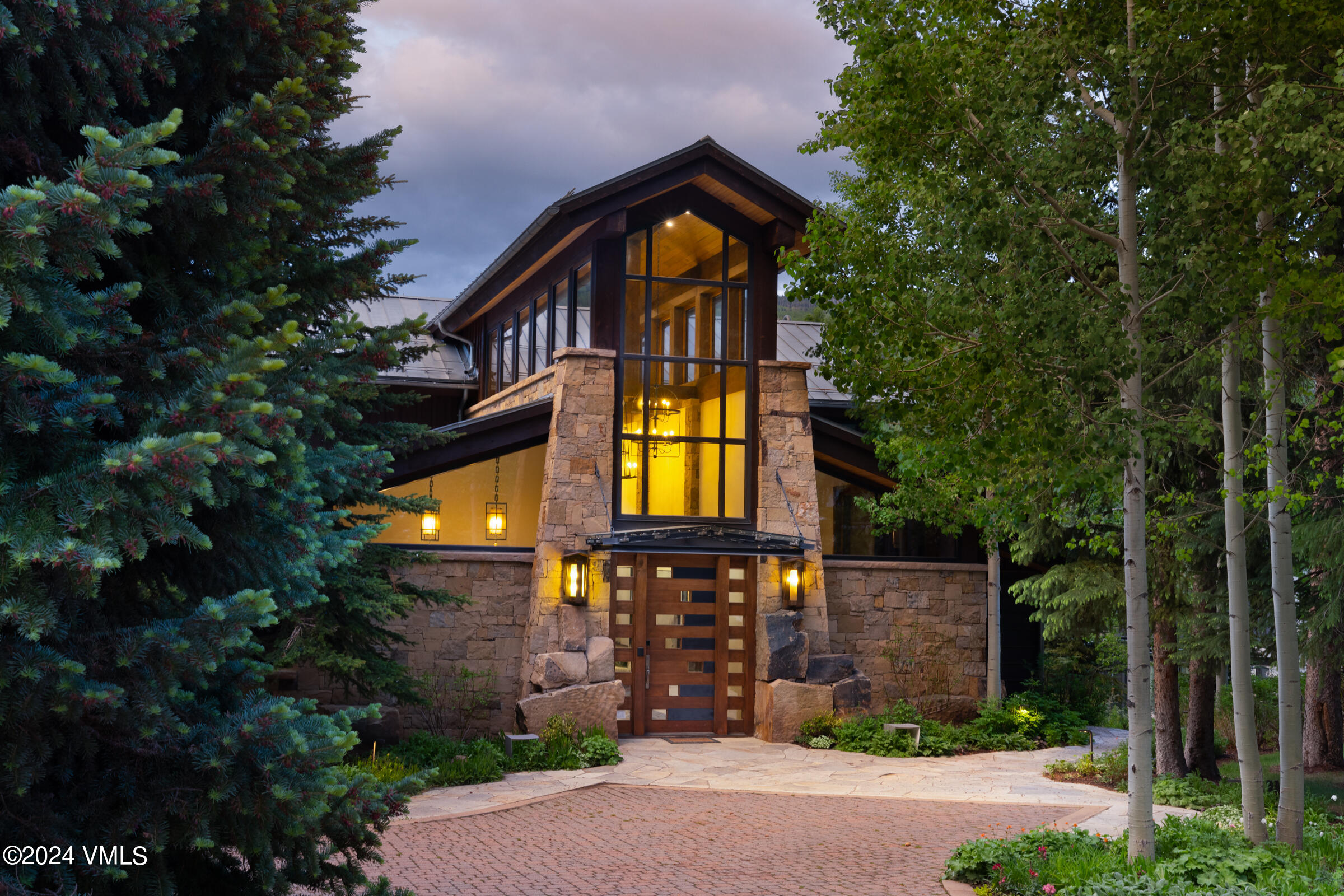 107 Rockledge Road Vail, CO 81657 - Photo 3 of 65 a front view of a house with garden