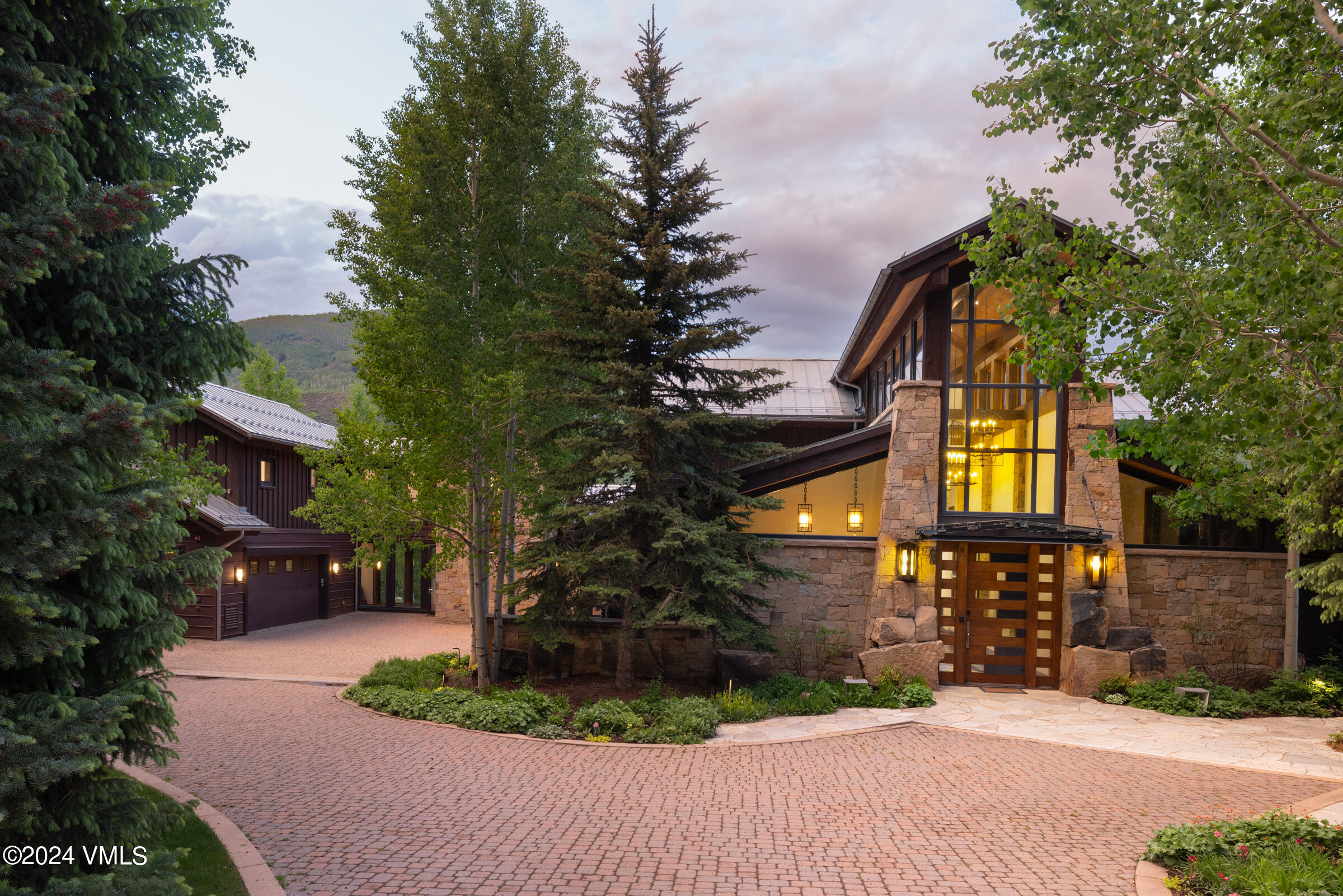 107 Rockledge Road Vail, CO 81657 - Photo 4 of 65 a front view of a house with a yard