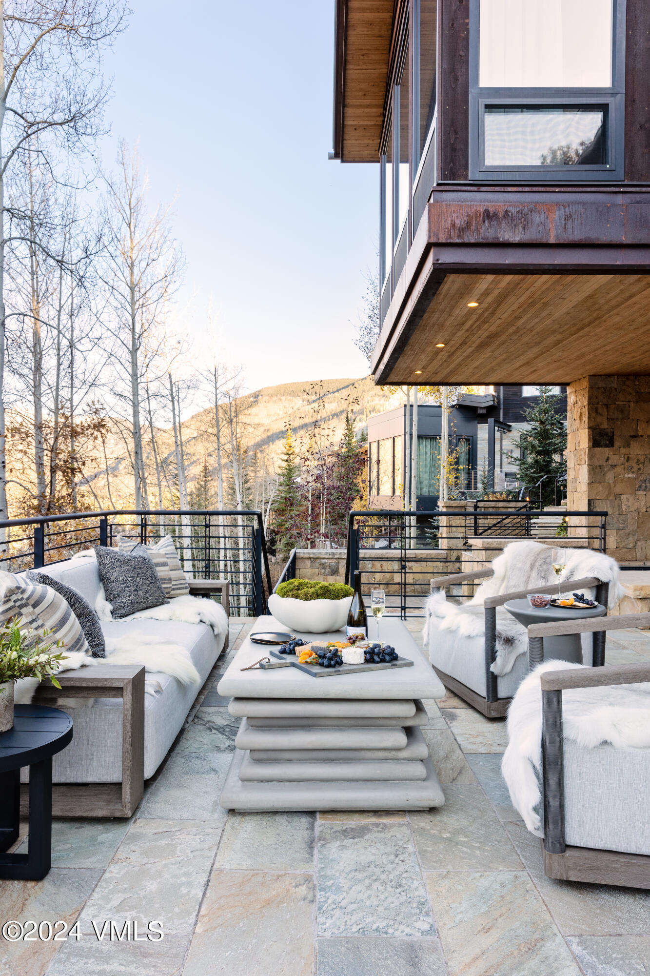 107 Rockledge Road Vail, CO 81657 - Photo 53 of 65 a view of a patio with couches and a table and chairs