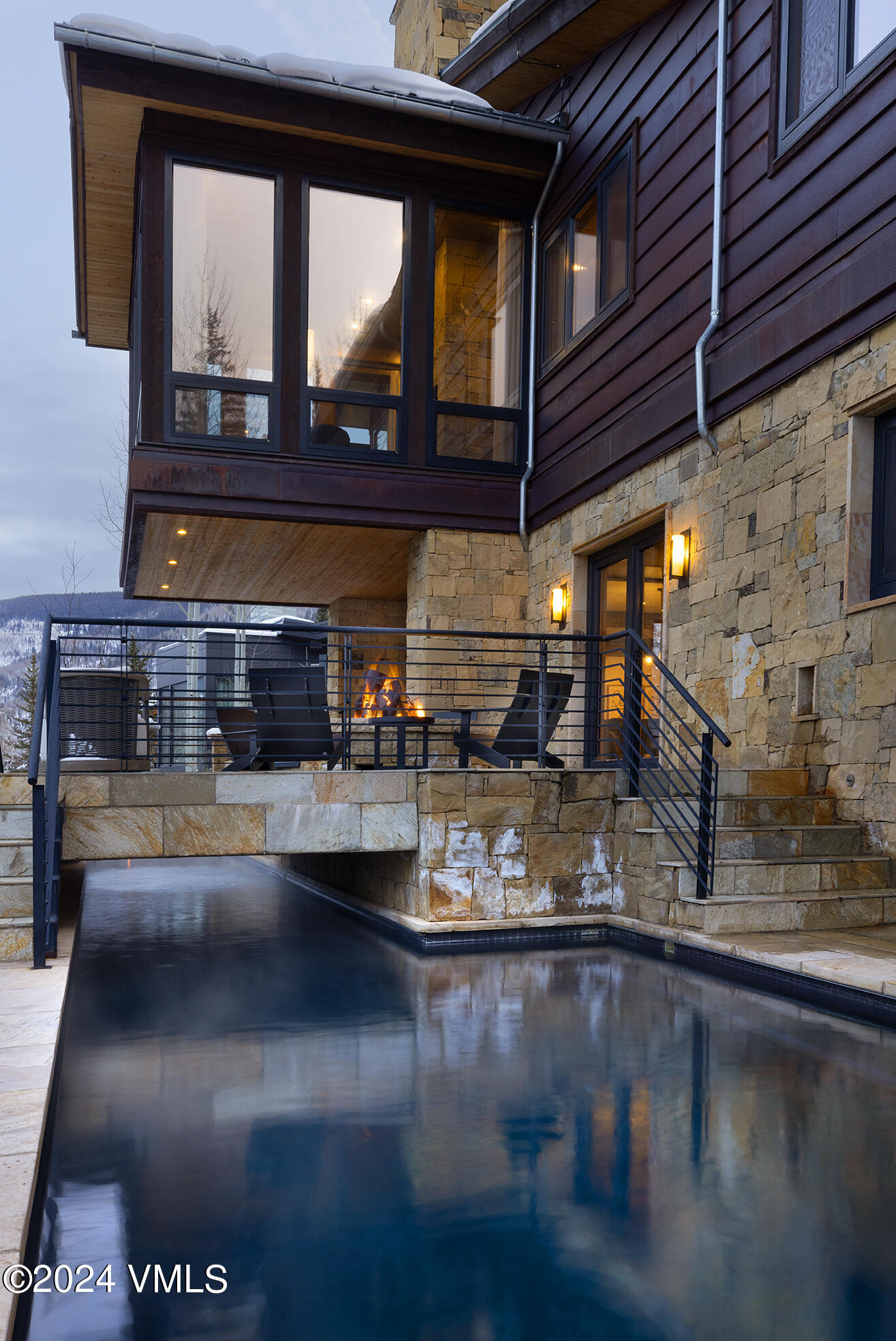 107 Rockledge Road Vail, CO 81657 - Photo 57 of 65 a view of a swimming pool with an outdoor seating