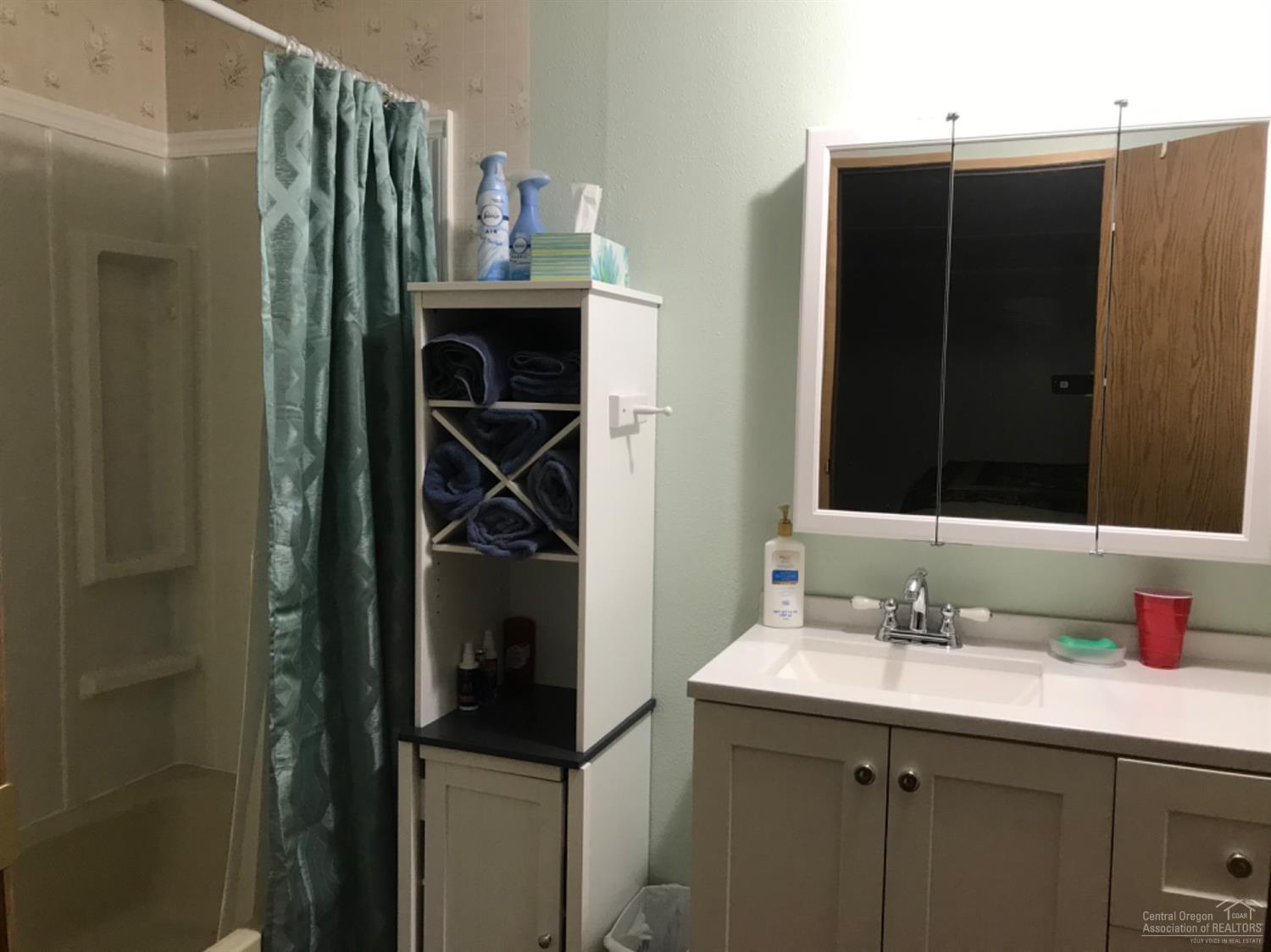 60901 Brosterhous Road, Unit 755 Bend, OR 97702 - Photo 10 of 23 a bathroom with a sink and a mirror