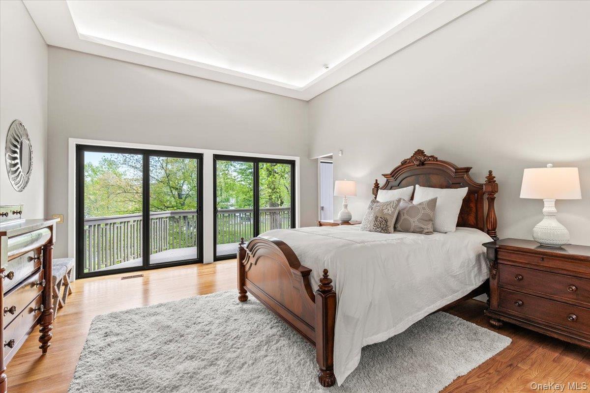 3 Lakeside Drive Rye, NY 10580 - Photo 10 of 36 Primary Bedroom with Ensuite bathroom , his/hers walk in closets, with private deck/balcony