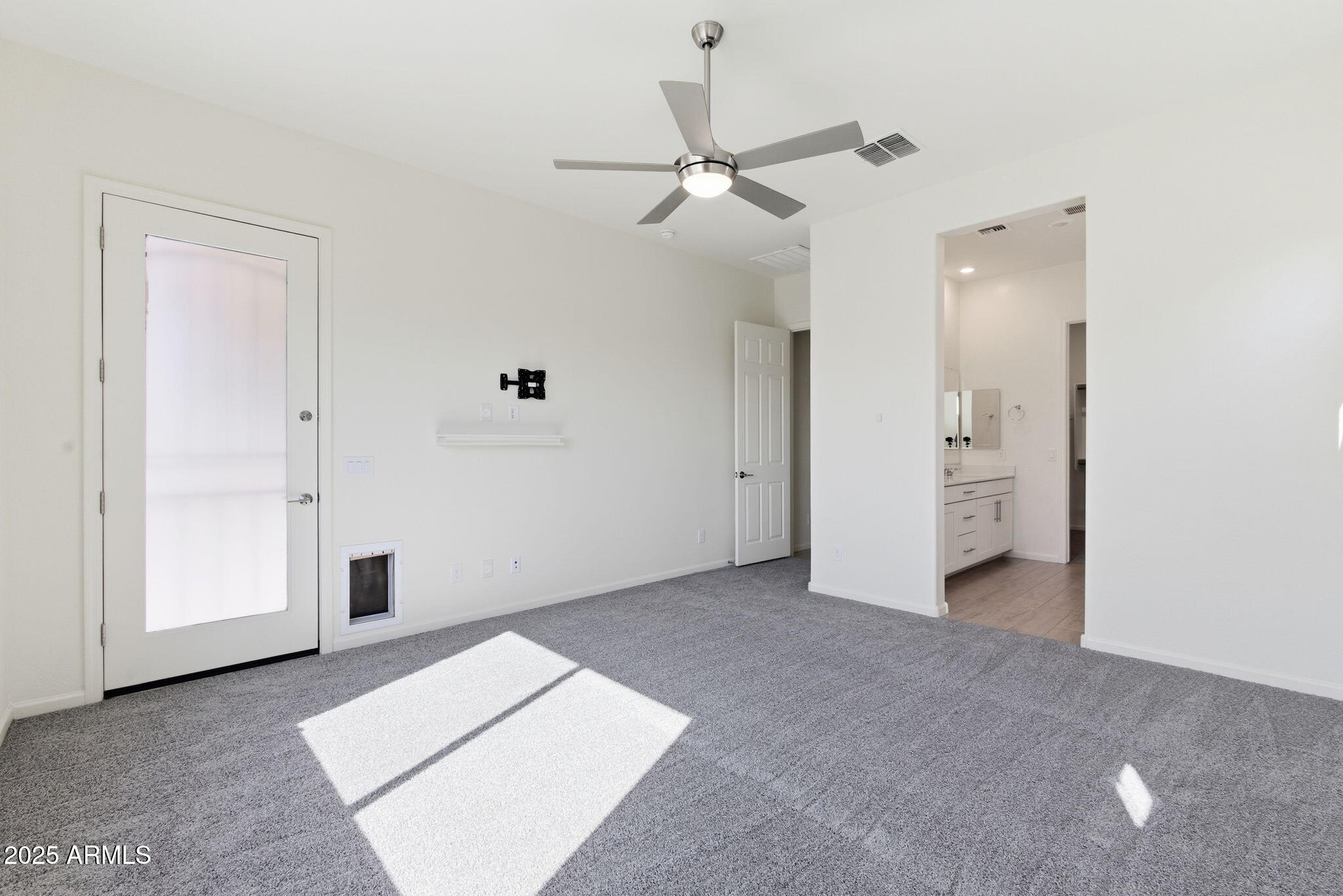 18545 West Chuckwalla Canyon Road Goodyear, AZ 85338 - Photo 12 of 26 an empty room with fan and entrance