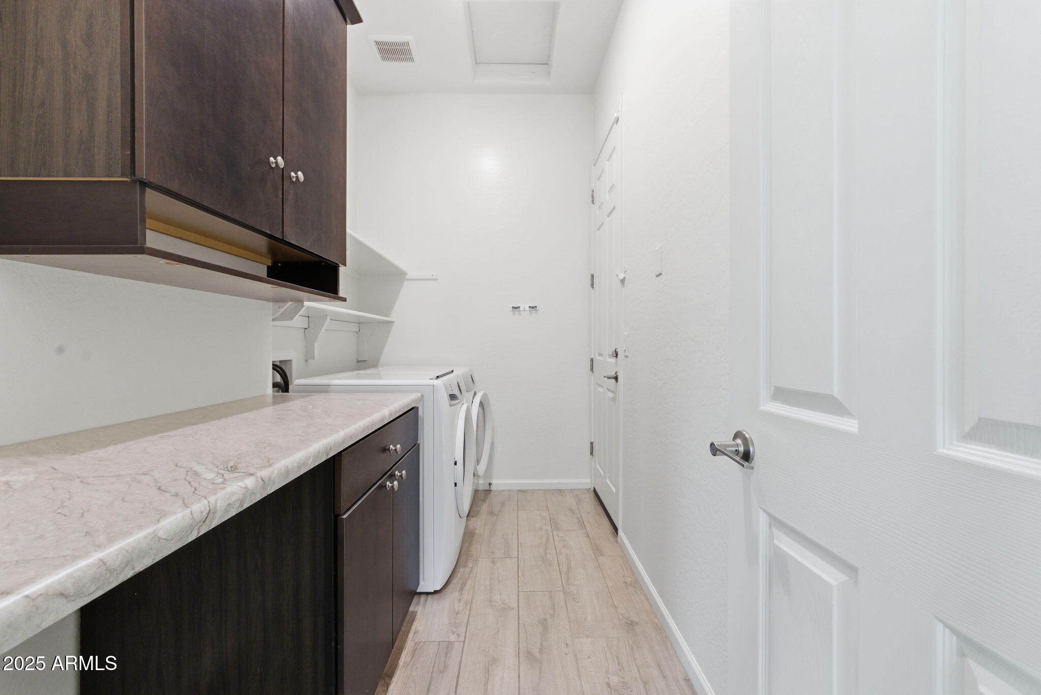 18545 West Chuckwalla Canyon Road Goodyear, AZ 85338 - Photo 16 of 26 a kitchen with a sink and a mirror