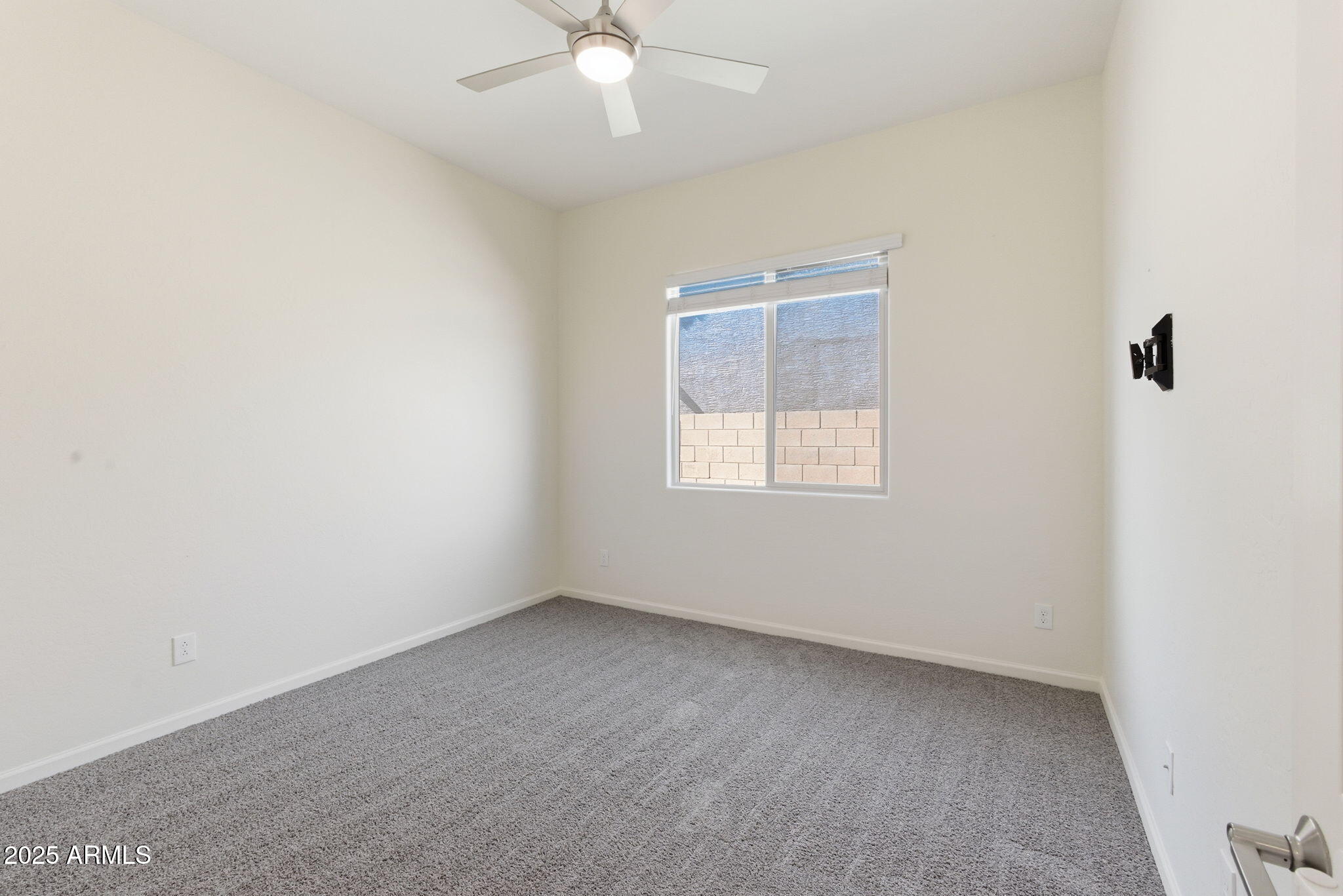 18545 West Chuckwalla Canyon Road Goodyear, AZ 85338 - Photo 17 of 26 an empty room with a window