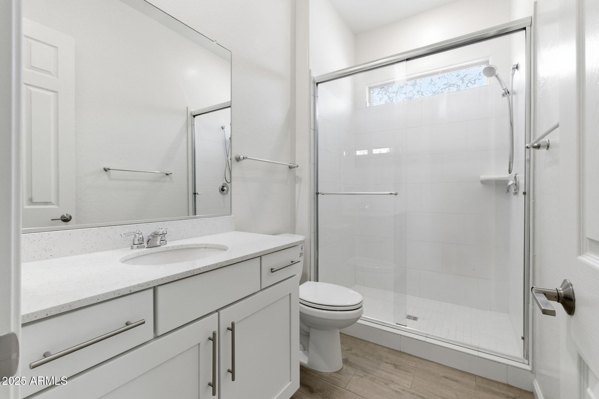 18545 West Chuckwalla Canyon Road Goodyear, AZ 85338 - Photo 23 of 26 a bathroom with a sink toilet and shower