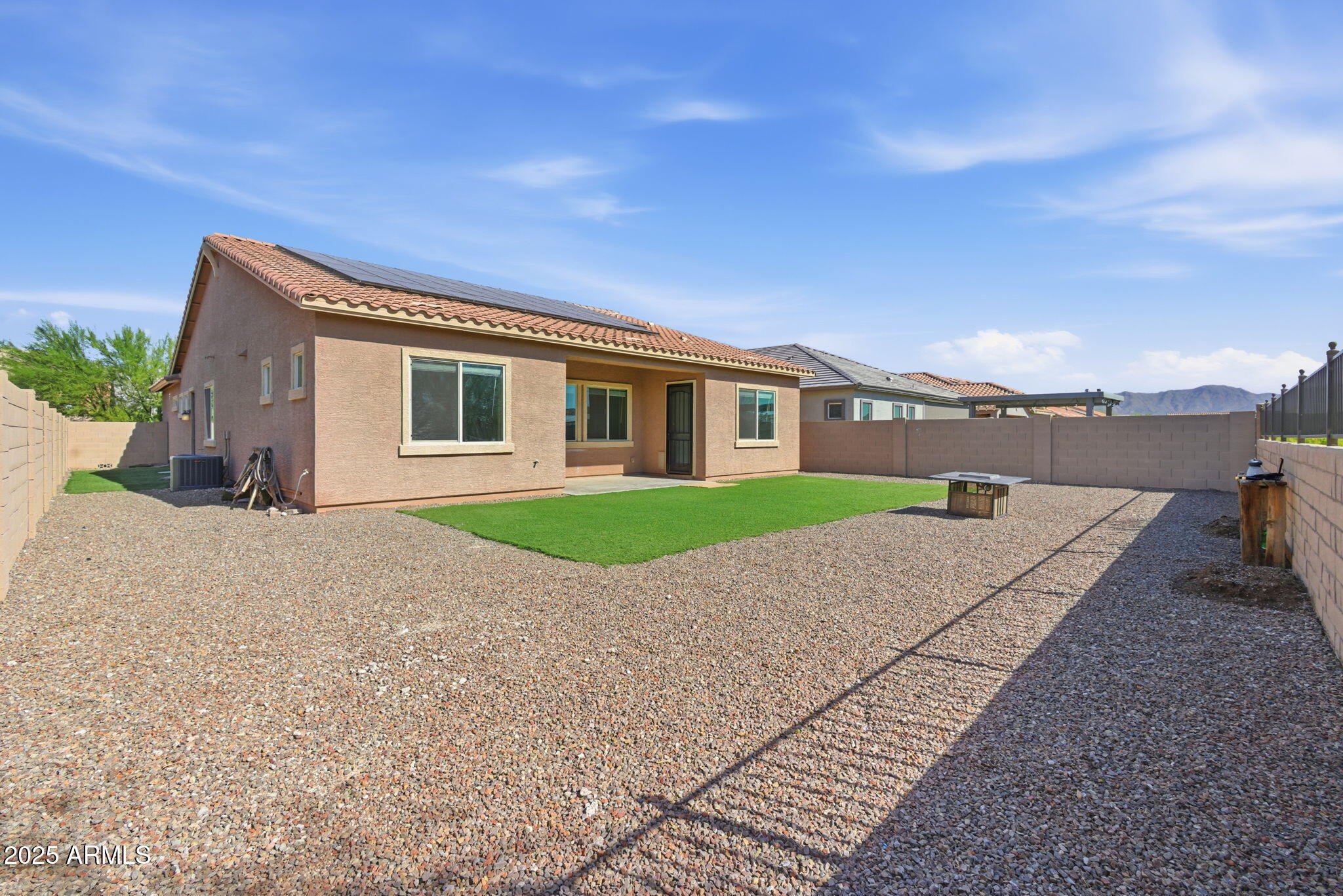 18545 West Chuckwalla Canyon Road Goodyear, AZ 85338 - Photo 25 of 26 a house with yard in front of it