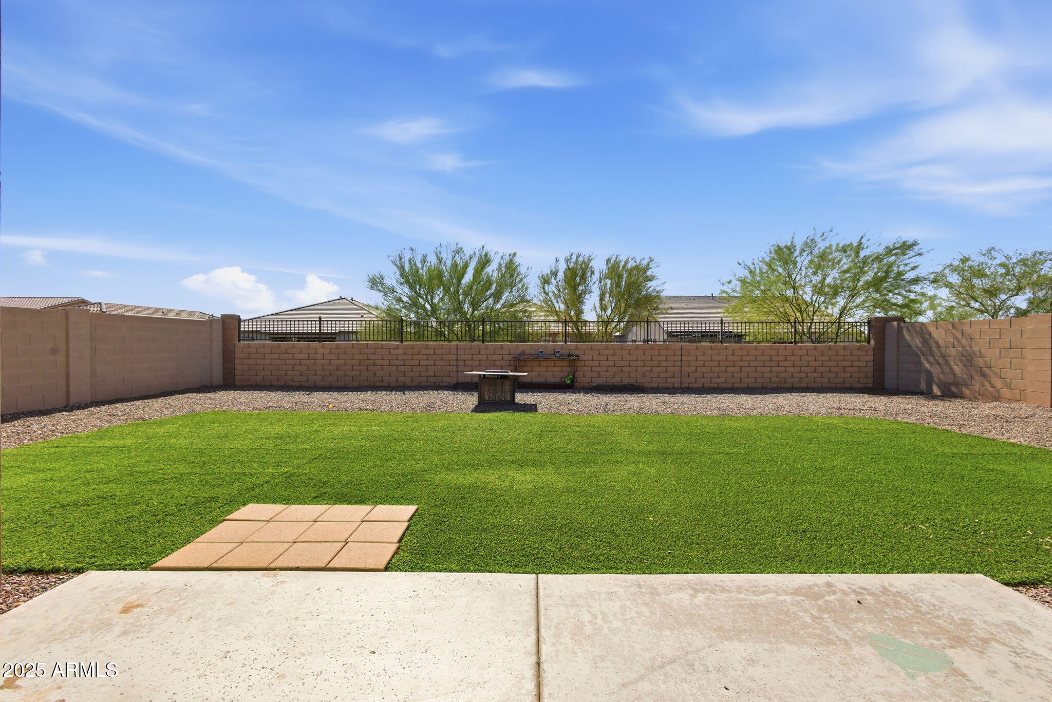 18545 West Chuckwalla Canyon Road Goodyear, AZ 85338 - Photo 26 of 26 a view of garden with palm trees