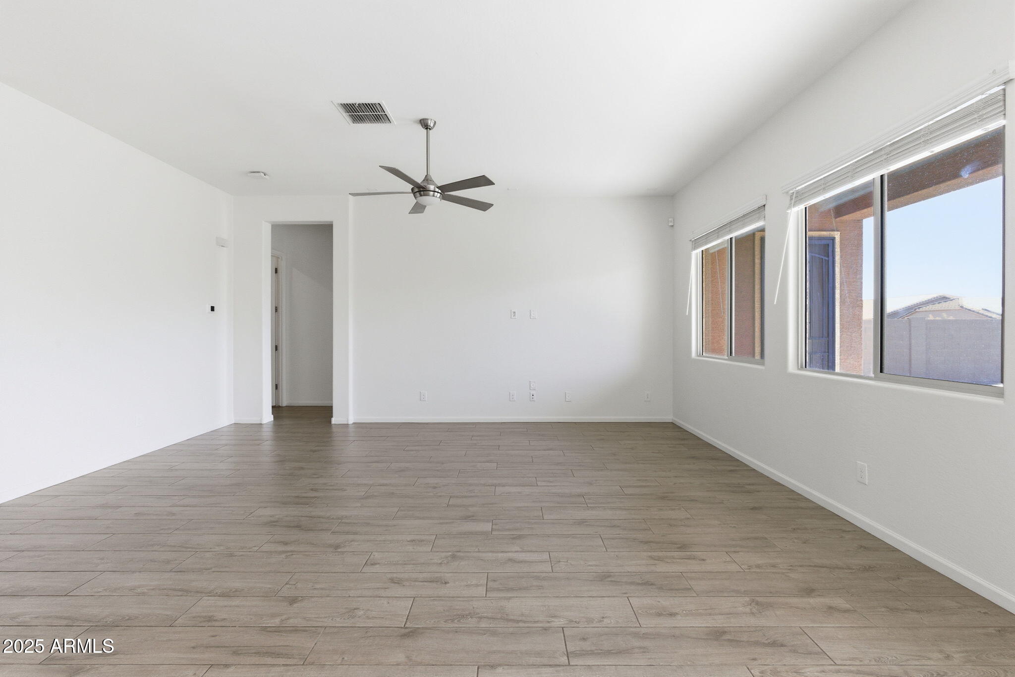18545 West Chuckwalla Canyon Road Goodyear, AZ 85338 - Photo 9 of 26 a view of an empty room with a window