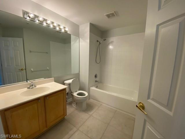 839 Hampton Circle, Unit 149 Naples, FL 34105 - Photo 13 of 32 a bathroom with a sink a toilet and shower