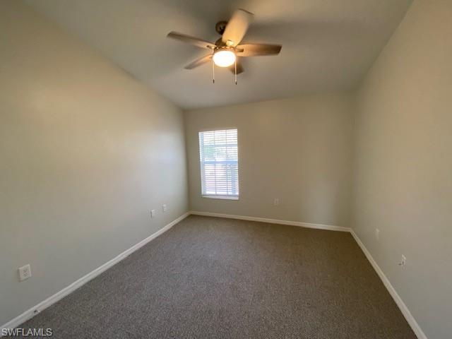839 Hampton Circle, Unit 149 Naples, FL 34105 - Photo 14 of 32 an empty room with a window and a fan