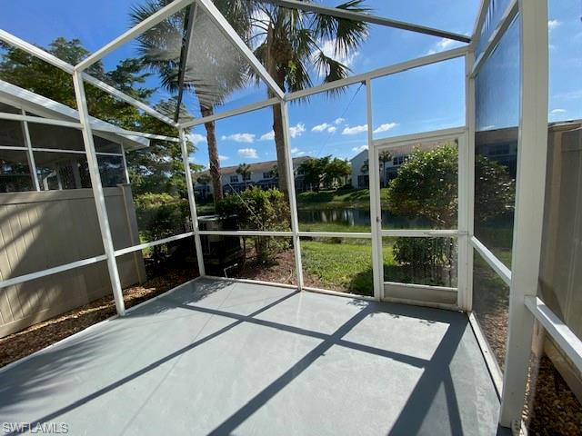 839 Hampton Circle, Unit 149 Naples, FL 34105 - Photo 21 of 32 a balcony with table and chairs