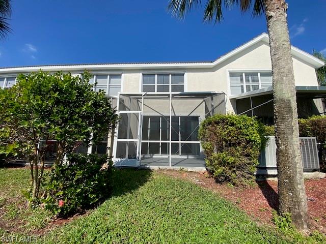 839 Hampton Circle, Unit 149 Naples, FL 34105 - Photo 22 of 32 a house view with a backyard space