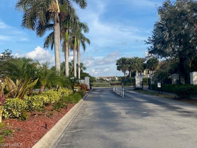 839 Hampton Circle, Unit 149 Naples, FL 34105 - Photo 25 of 32 a view of a yard with a slide