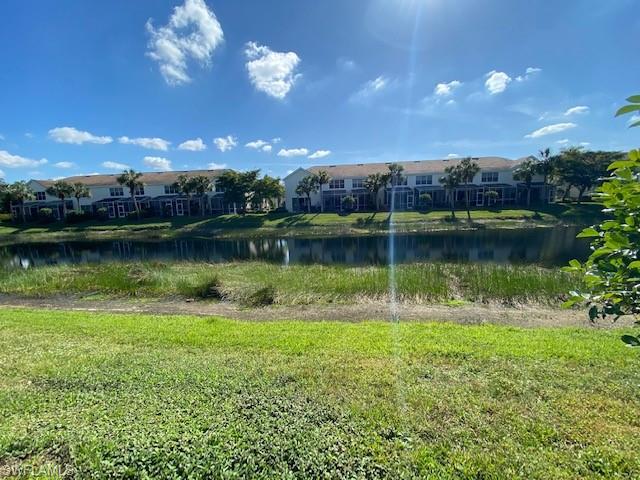 839 Hampton Circle, Unit 149 Naples, FL 34105 - Photo 26 of 32 a view of a lake with a city