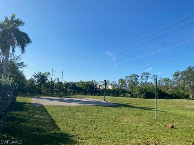 839 Hampton Circle, Unit 149 Naples, FL 34105 - Photo 27 of 32 a view of a golf course with a lake