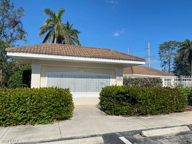 839 Hampton Circle, Unit 149 Naples, FL 34105 - Photo 29 of 32 front view of a house