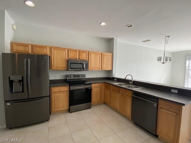 839 Hampton Circle, Unit 149 Naples, FL 34105 - Photo 6 of 32 a kitchen with granite countertop stainless steel appliances and a sink