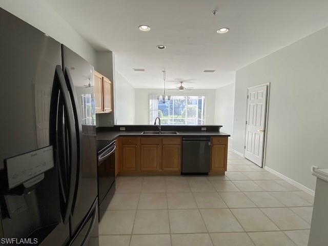 839 Hampton Circle, Unit 149 Naples, FL 34105 - Photo 8 of 32 a bathroom with a granite countertop sink and a refrigerator