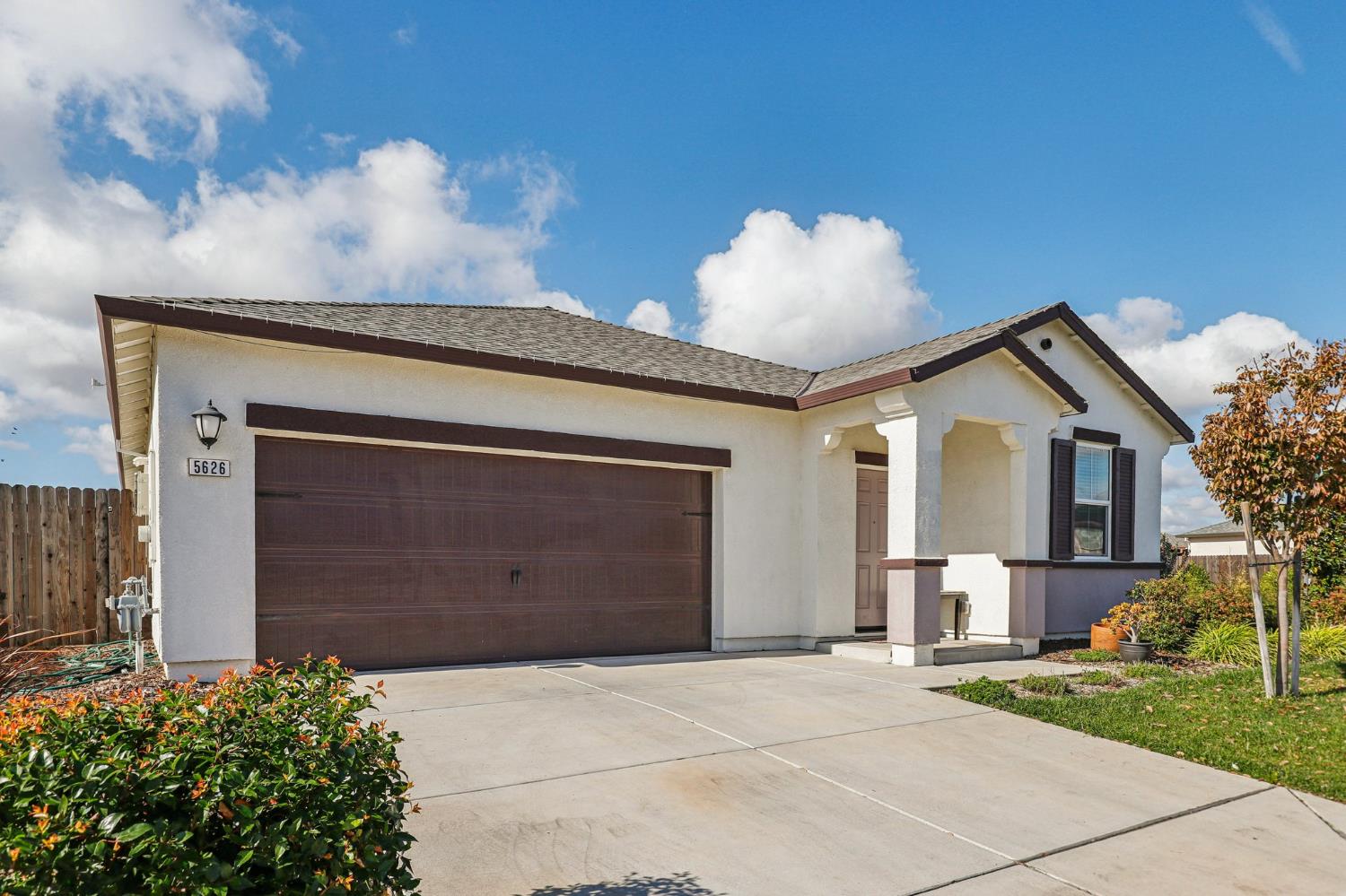 5626 Sunhaven Street Marysville, CA 95901 - Photo 2 of 31 a front view of a house with a yard and garage
