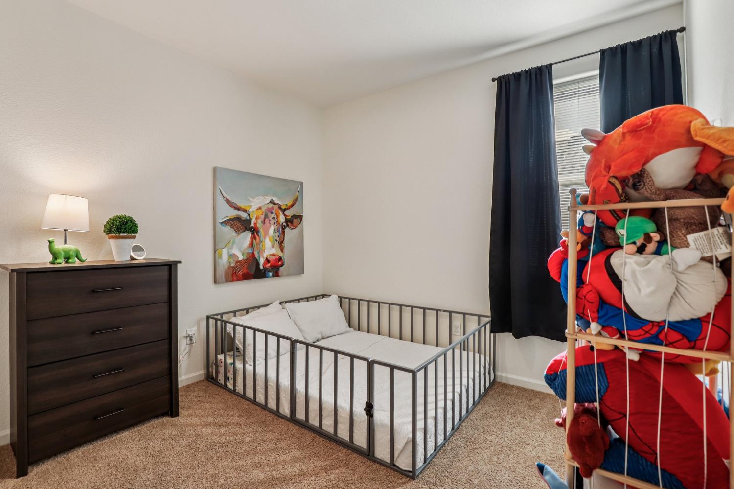 5626 Sunhaven Street Marysville, CA 95901 - Photo 22 of 31 a bedroom with furniture and a baby crib