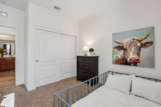a view of a hallway with paintings on the wall