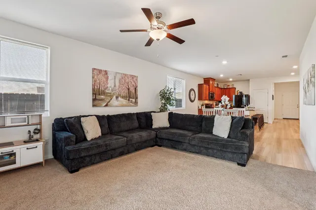 a living room with furniture and a large window