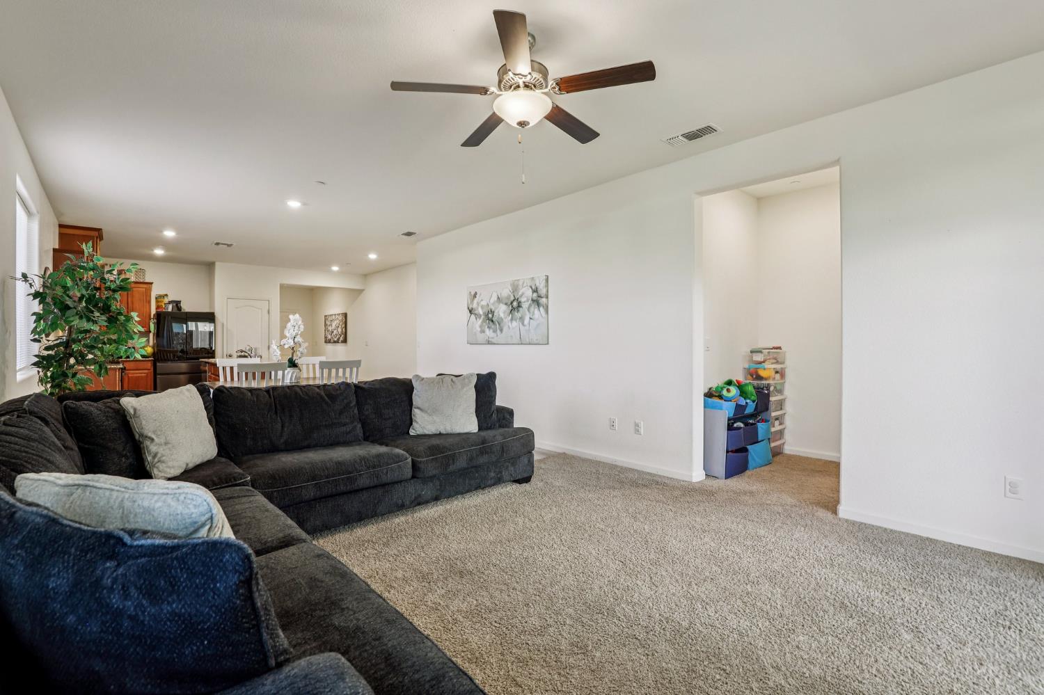 5626 Sunhaven Street Marysville, CA 95901 - Photo 6 of 31 a living room with furniture and a chandelier