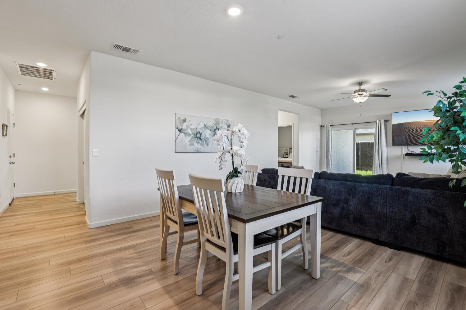 5626 Sunhaven Street Marysville, CA 95901 - Photo 8 of 31 a view of a dining room with furniture and wooden floor
