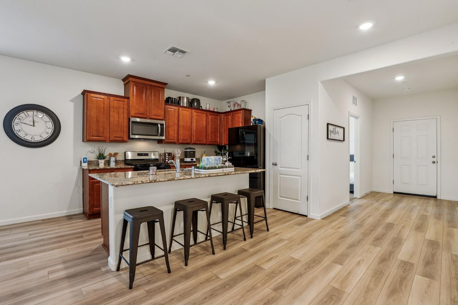 5626 Sunhaven Street Marysville, CA 95901 - Photo 10 of 31 a kitchen with cabinets and wooden floor