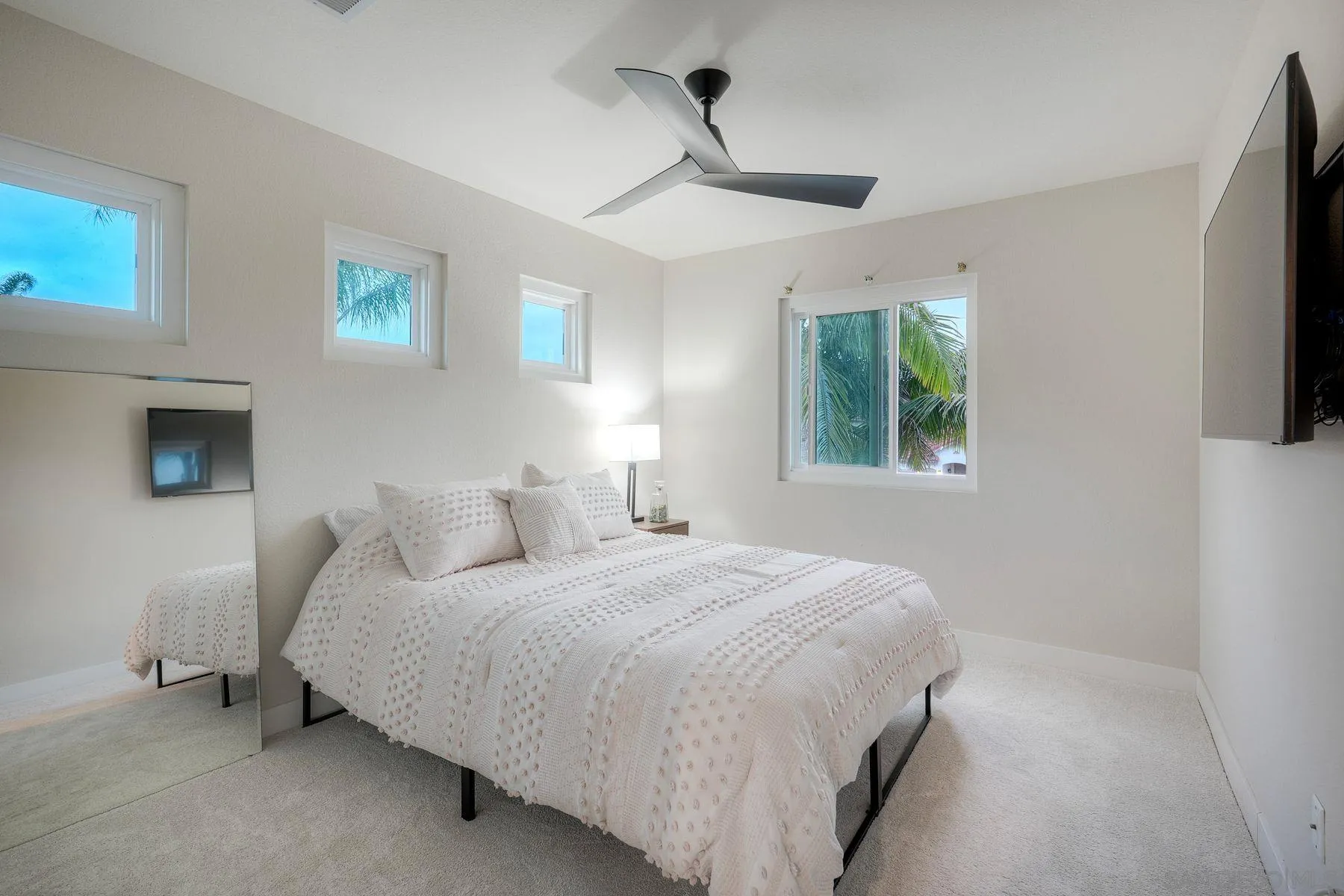 529 Peach Tree Way San Marcos, CA 92069 - Photo 19 of 30 a bedroom with a bed and a flat tv screen on the dresser