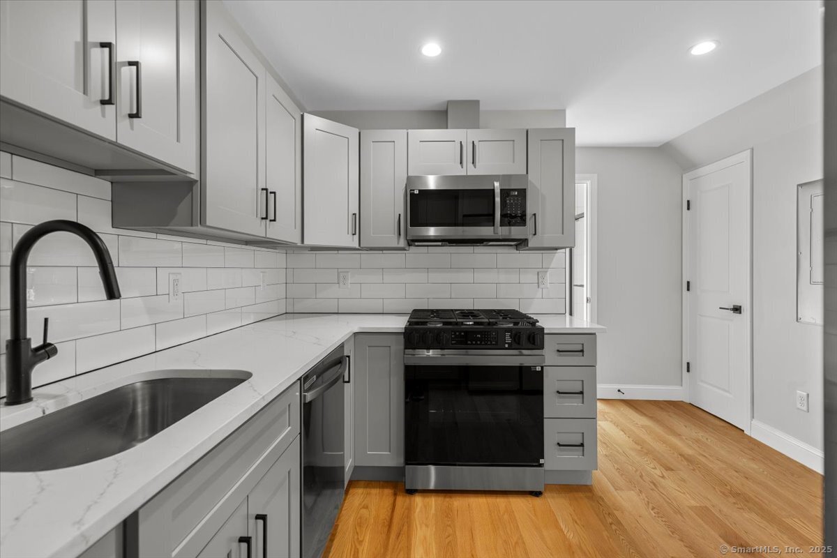 a kitchen with a stove and a microwave
