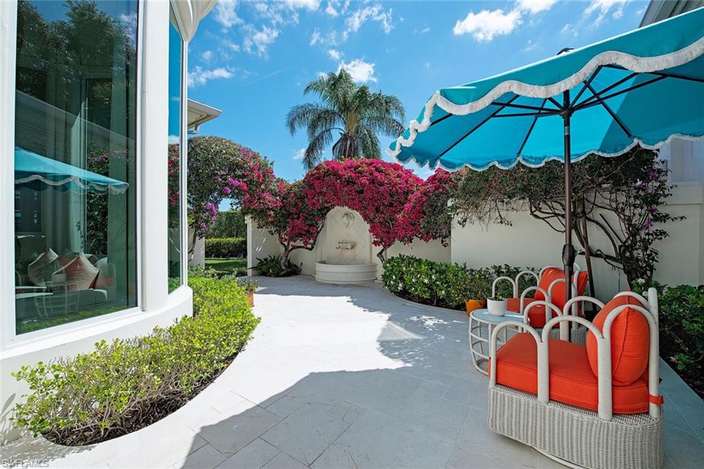 13741 Pondview Circle Naples, FL 34119 - Photo 13 of 50 a view of outdoor space patio and swimming pool