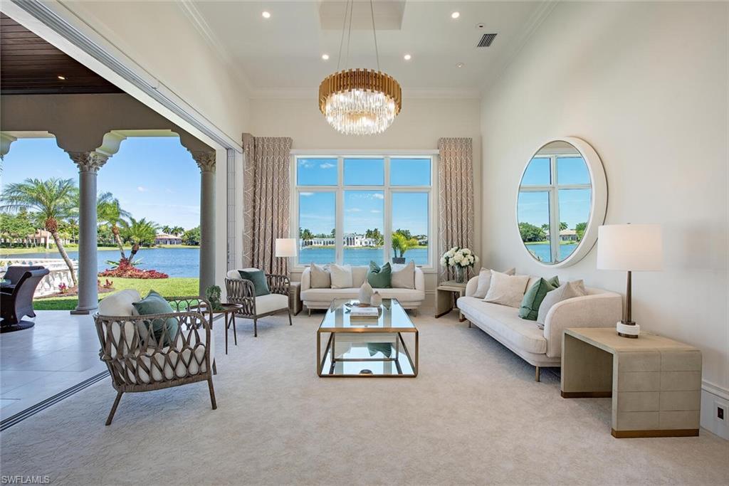 13741 Pondview Circle Naples, FL 34119 - Photo 16 of 50 a living room with furniture and a large window