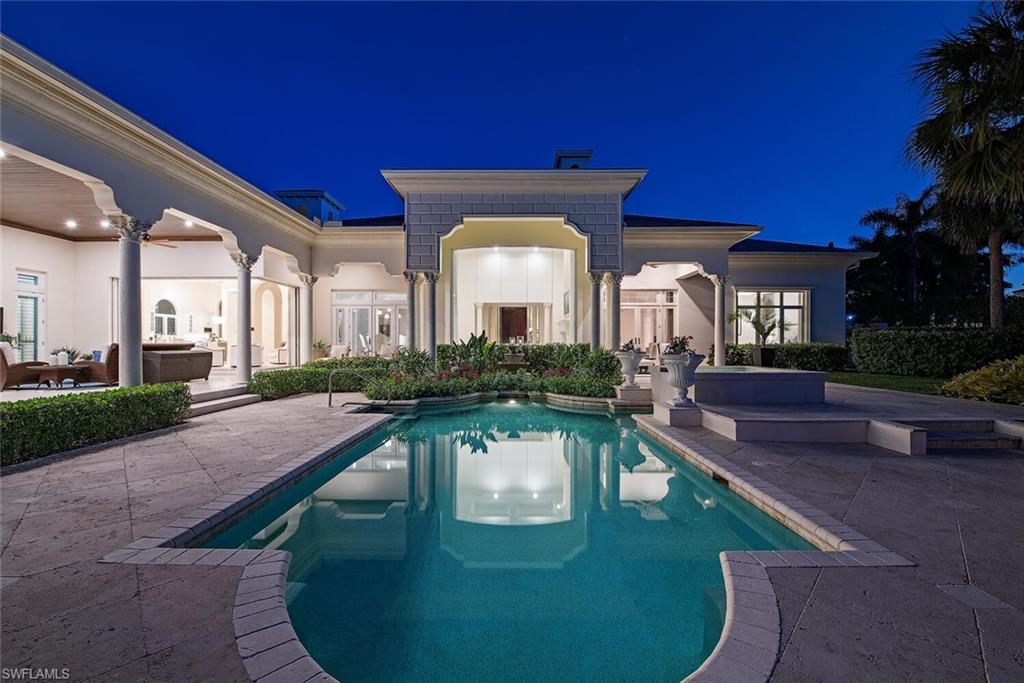 13741 Pondview Circle Naples, FL 34119 - Photo 18 of 50 a view of a house with a swimming pool