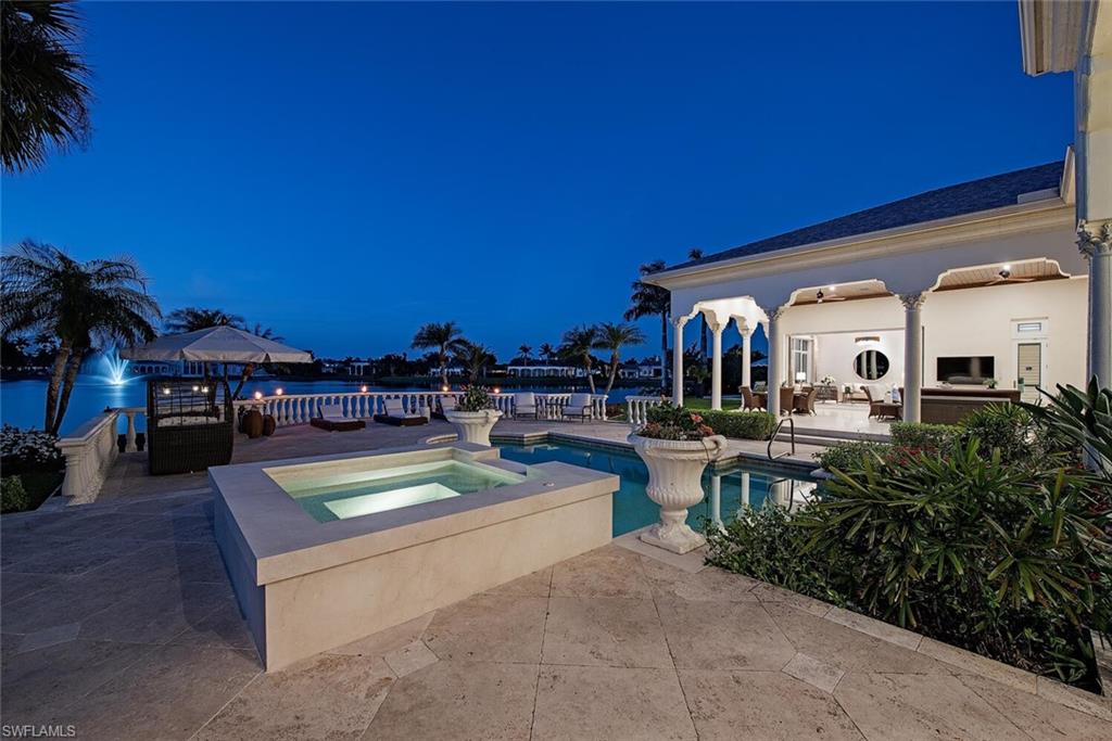 13741 Pondview Circle Naples, FL 34119 - Photo 20 of 50 a view of a house with swimming pool and sitting area